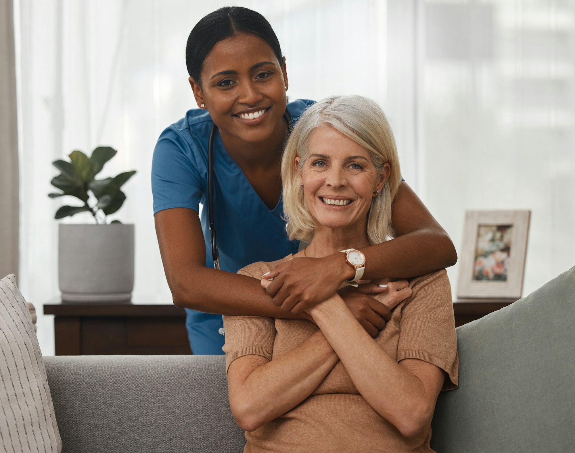 My nurse, my carer, my companion. Shot of a doctor caring for a senior woman at home.